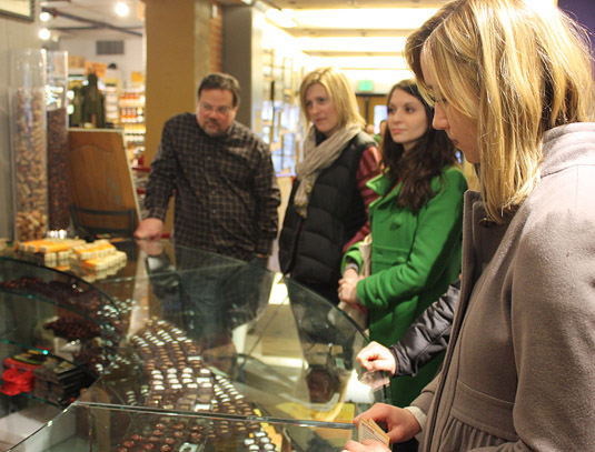 Our Foodie Tour group, listening and tasting delightful chocolates at Tony Caputo's, Salt Lake City.