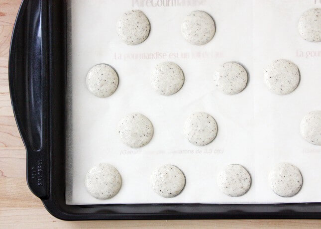 Vanilla bean macarons, piped and ready to be baked // FoodNouveau.com