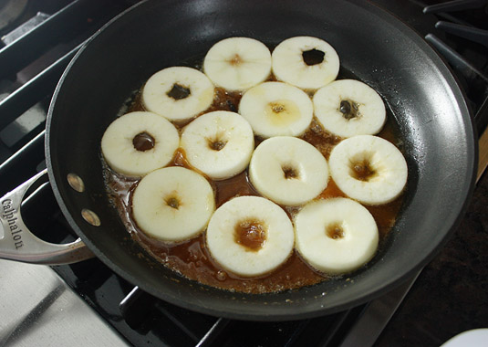 Scatter the apple slices in the skillet, making sure they don’t overlap.