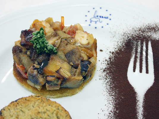 Traditional Sicilian caponata with eggplant, onions, raisins, and cocoa.