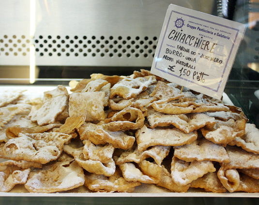 Chiacchiere: Fried (or baked) dough sprinkled with powdered sugar. A classic. 