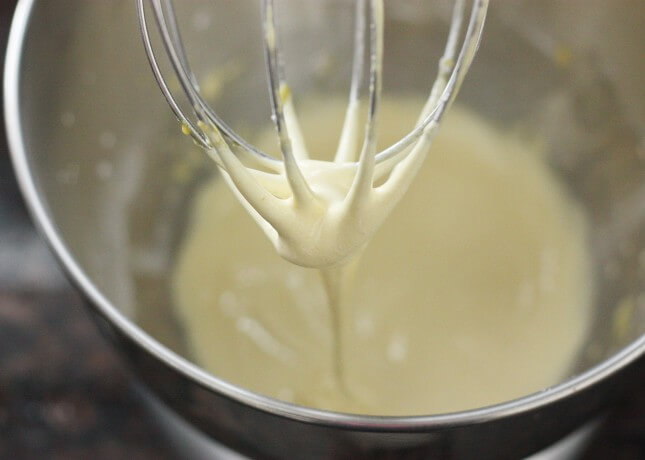 In the bowl of an electric mixer, beat together the sugar, flour, cornstarch, and egg yolks until thick and pale yellow, about two minutes. // FoodNouveau.com