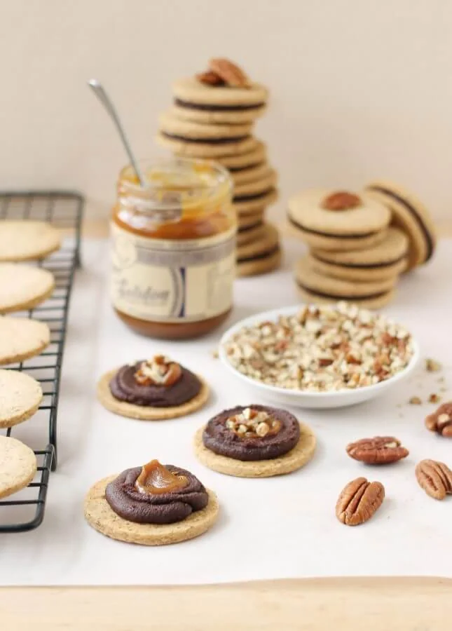Pecan Shortbread Cookies with a Dark Chocolate Ganache and Caramel Filling // FoodNouveau.com