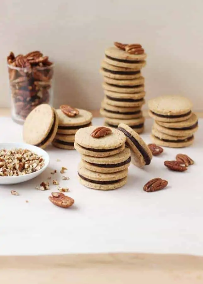 Pecan Shortbread Cookies with a Dark Chocolate and Caramel Filling // FoodNouveau.com