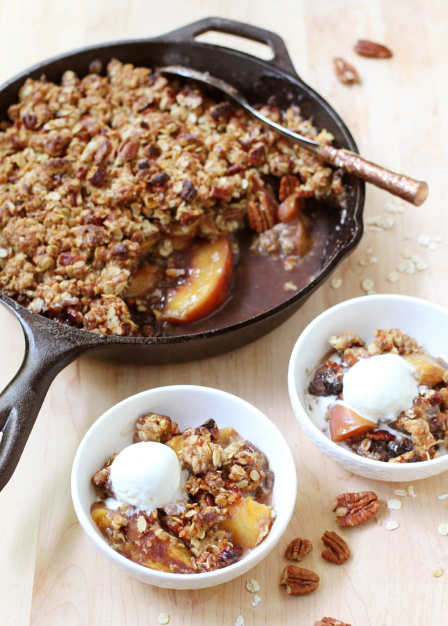 This aromatic Bourbon Peach Crisp combines classic southern ingredients to produce a dessert that marries jammy fruits and a crunchy topping. // Bourbon Peach Crisp // FoodNouveau.com