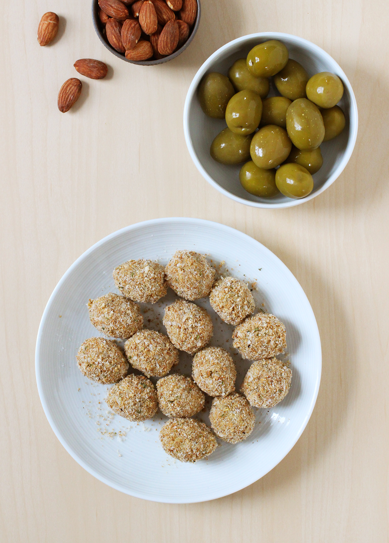 Fried olives made with plump green olives and stuffed with almonds are a tasty snack to enjoy with cocktails // FoodNouveau.com