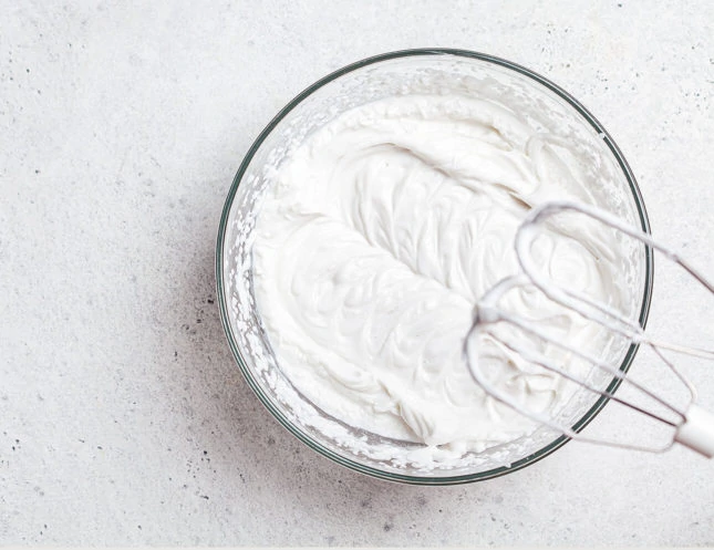 Whipped cream is an easy way to dress up easy yogurt cake! // FoodNouveau.com