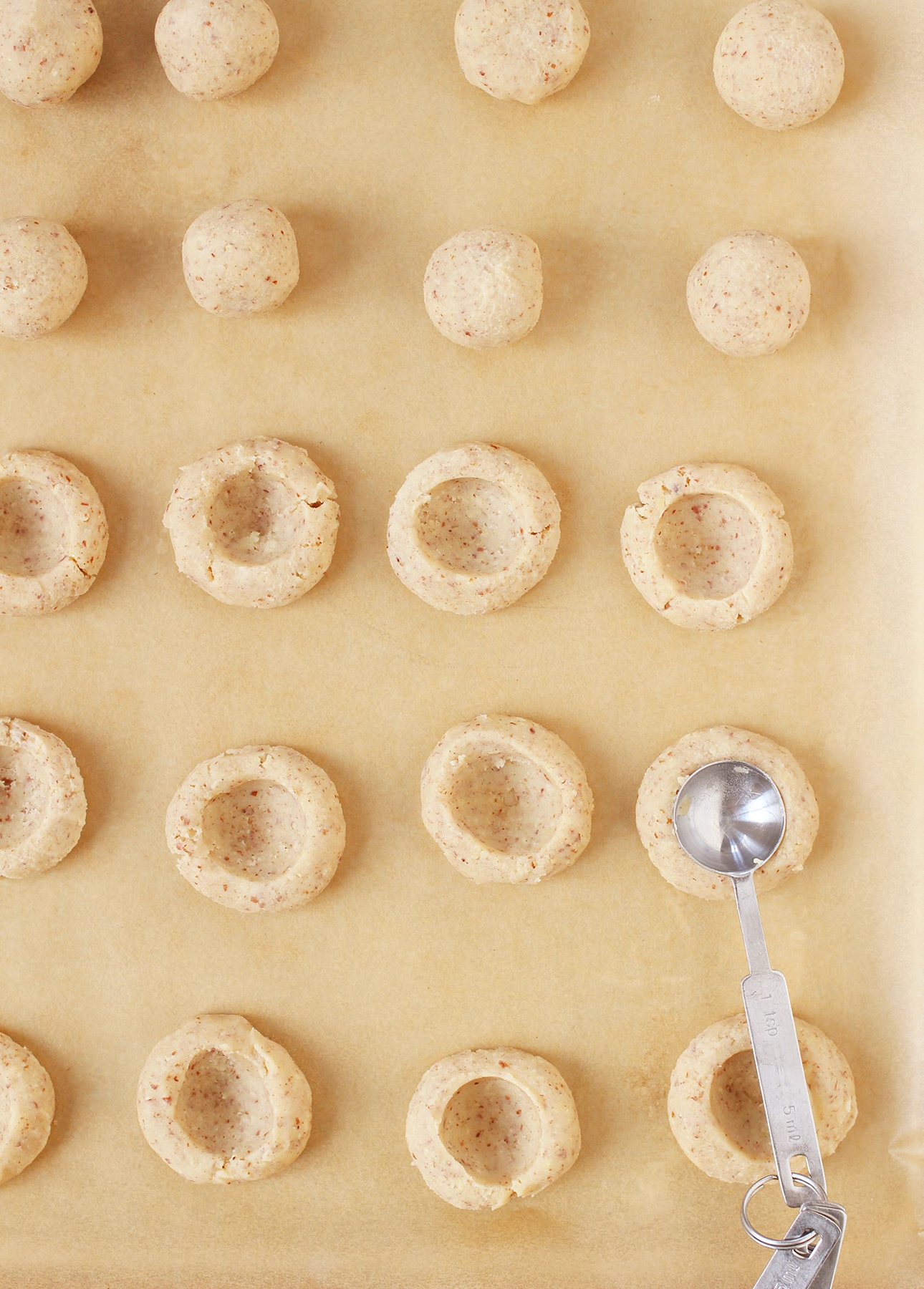 Creating indentations in maple thumbprint cookies // FoodNouveau.com