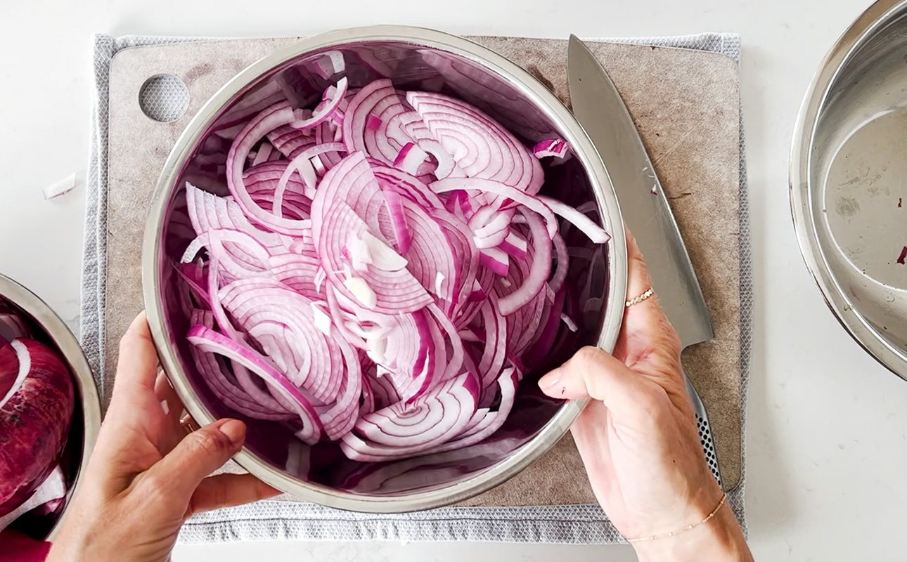 A bowl of sliced red onions // FoodNouveau.com