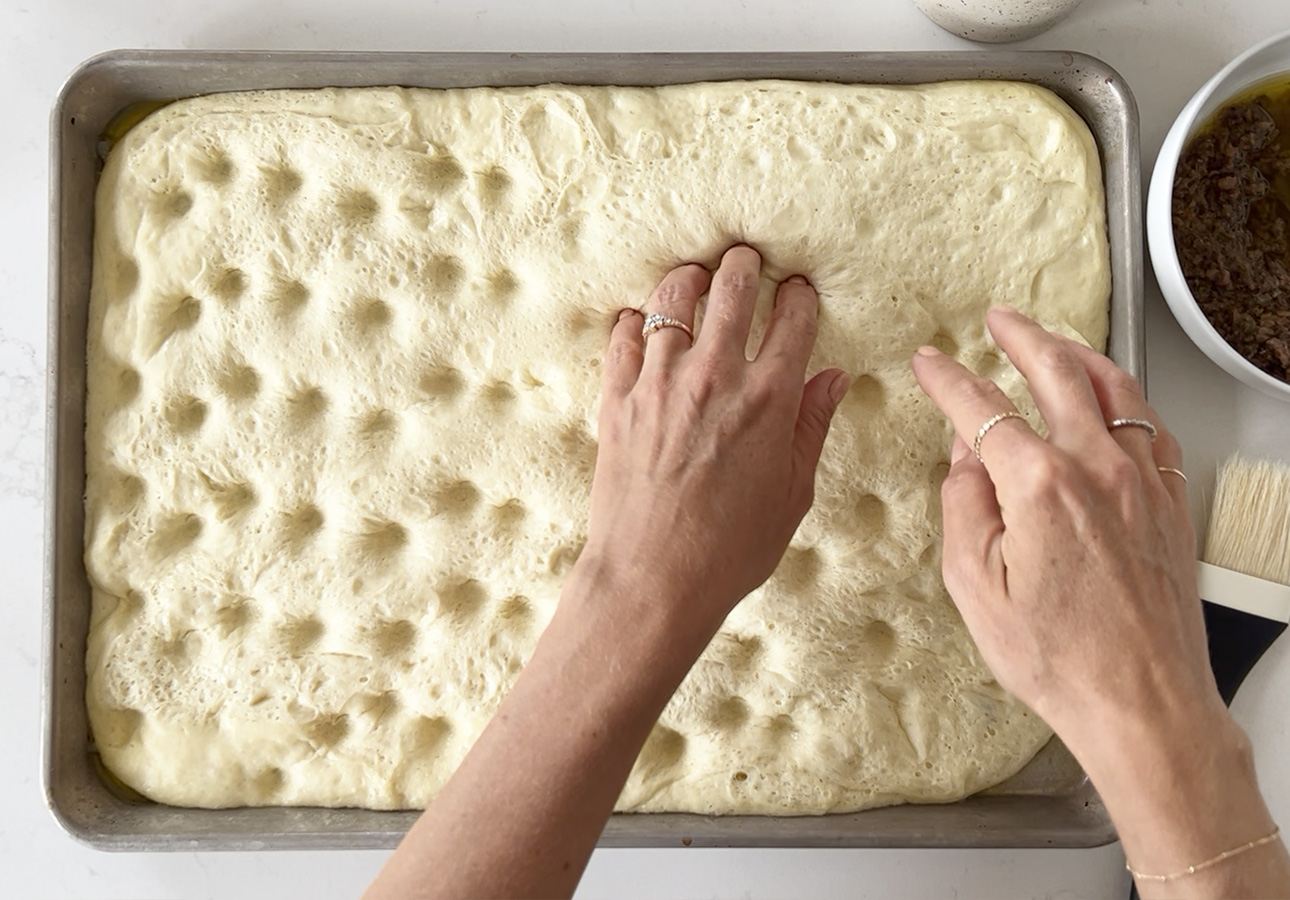 Creating indentations in Provençal flatbread using finger tips // FoodNouveau.com