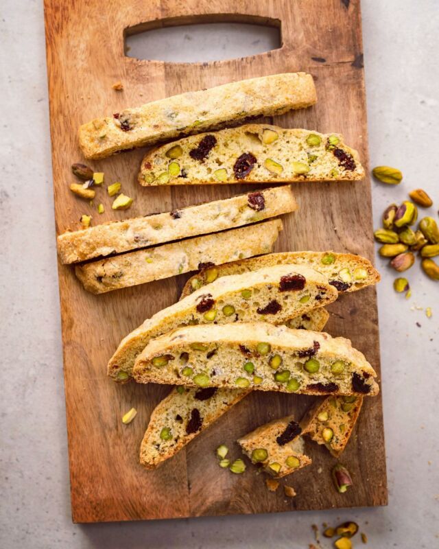 CRANBERRY PISTACHIO BISCOTTI 💚
.
Did you know? What the rest of the world knows as biscotti—the crunchy, dry, oblong cookies studded with nuts—are called cantucci in Italy. In modern Italian, "biscotti" means cookies of any kind, but in Latin, the word also means "twice-cooked." This is certainly why the term stuck to describe cantucci, which are cookies that are indeed twice-baked.
.
Cantucci originate from the town of Prato, in Tuscany. Traditional cantucci combine only flour, sugar, eggs, pine nuts, and almonds into a thick dough that us shaped into a flat slab, baked, then sliced and baked again. The second baking period is what makes the cantucci dry and very crunchy.
.
After avoiding tins of stale biscotti when I was growing up, I fell in love with the treat when I traveled to Tuscany as a young adult. During my trip, many meals ended with a cantuccio and a glass of vin santo, an amber-colored fortified Tuscan wine you’re meant to dip your cookie in. This harmonious combo concluded hearty Tuscan meals in a simple, unfussy, just-sweet-enough way 👌🏼
.
Vin santo is hard to find where I live, but you better believe this isn’t stopping me from baking and enjoying biscotti. The crunchy, nut-based cookie is just as good dipped in coffee or tea!
.
My cantucci recipe combines three of my favorite flavors: cranberry, pistachio, and orange. The trio creates such luxurious, festive biscotti, nobody can resist them! If you've never made biscotti at home, give them a try: they're easy to make, have a long shelf life, and are sturdy enough to travel. Perfect for holiday cookie swaps! 🎁
.
Click the link in my profile to get my recipe for Cranberry Pistachio Biscotti!
Or copy + paste: https://foodnouveau.com/cranberry-pistachio-biscotti/
As always, you can also DM me for the direct link! 🤗