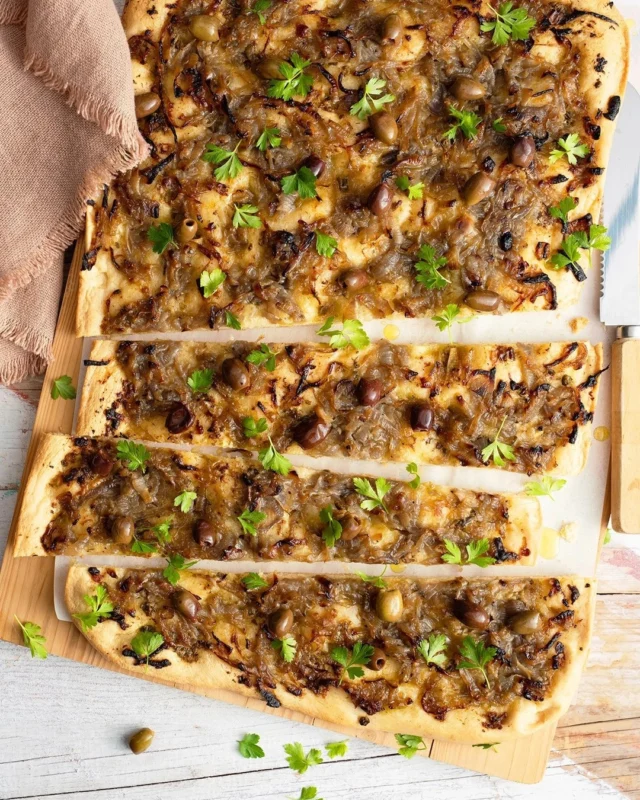 I just refreshed one of my favorite apéro recipes: Pissaladière, the Provençal onion flatbread that’s golden, savory, salty-sweet, and absolutely made for slicing into squares and serving with a chilled glass of rosé 🥂
.
It’s layered with silky caramelized onions, a punchy anchovy-and-caper anchoïade, Niçoise olives, and lots of fresh herbs. Don’t let the anchovies scare you off: instead of arranging whole fillets on top, I tuck them into the anchoïade so they bring deep savory flavor without taking over 😏 
.
Get my recipe for Pissaladière through the link in my profile, or comment RECIPE and I'll DM you the direct link right away!
.
https://foodnouveau.com/pissaladiere-provencal-flatbread/
.
#pissaladiere #frenchrecipes #provencalfood #aperotime #savorybaking